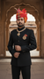 Default black bandhgala jodhpuri suit in fabric with a front pose showcasing royal elegance