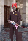 Elegant Bhati Coat Suit for Men in brown with traditional accessories and vibrant pagri