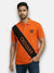 Men's orange polo M'TSHIRTS in cotton with a front angle showing chouhan logo t-shirts