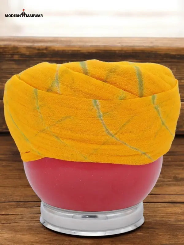 Vibrant yellow cotton safa turban with unique design, perfect for traditional wear and celebrations