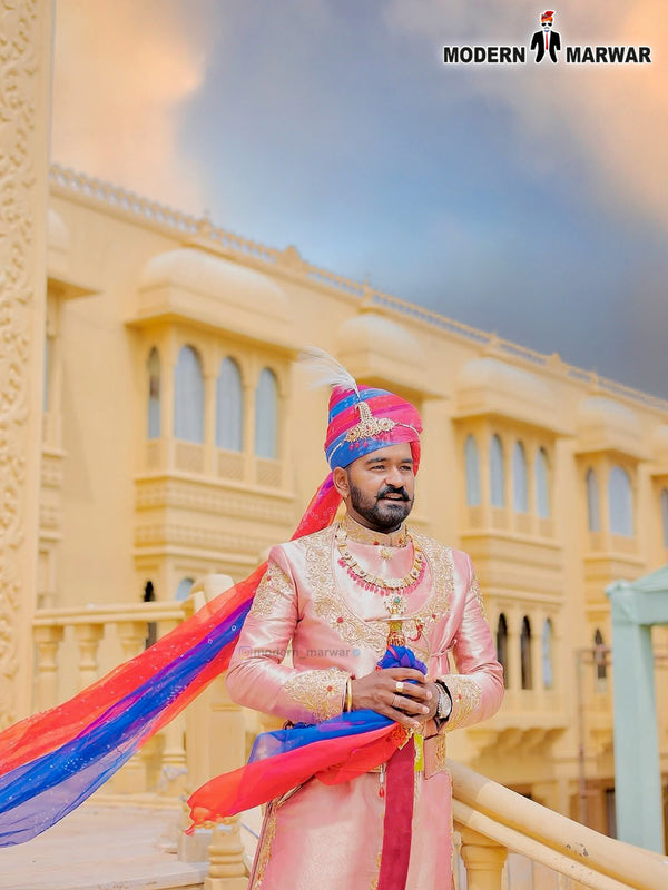 Elegant designer Angarkha sherwani online with intricate embellishments and vibrant sash for special occasions