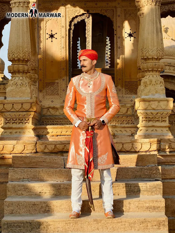 Stylish designer Angarkha sherwani outfit in orange with traditional embellishments for festive occasions