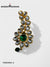 Elegant designer brooch for wedding attire with green stones and intricate gold detailing