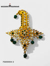 Elegant designer brooch for wedding attire featuring intricate gold detailing and green accents