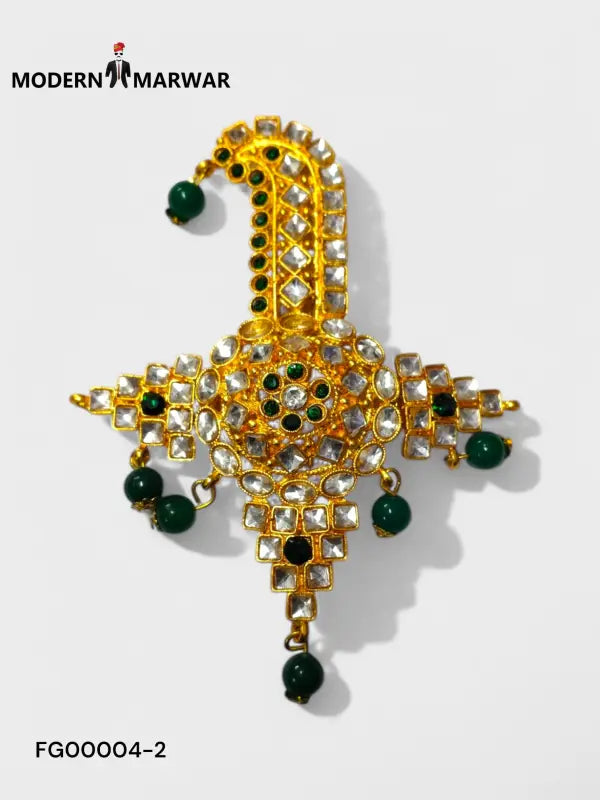 Elegant designer brooch for wedding attire featuring intricate gold detailing and green accents