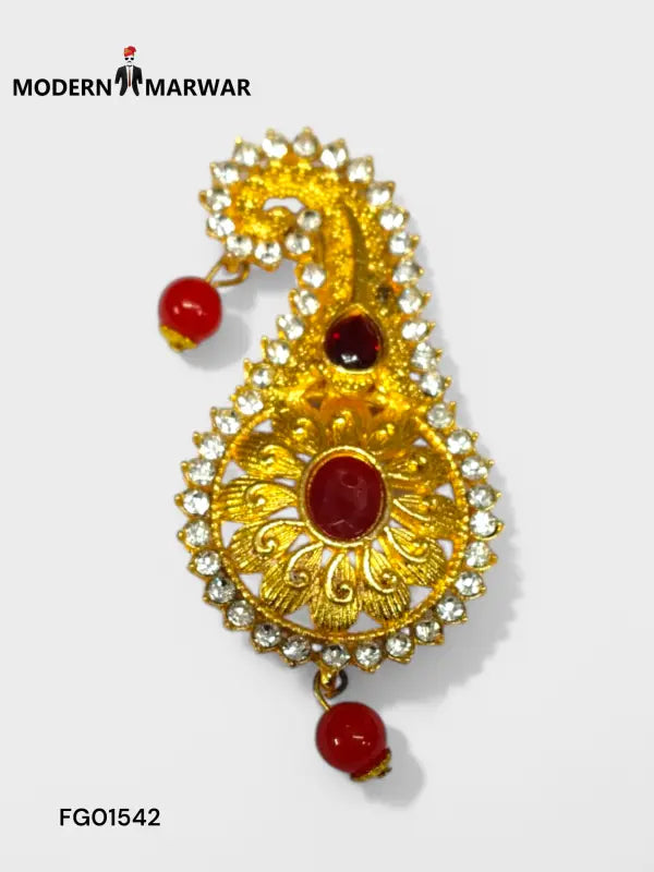 Elegant designer brooch for wedding attire featuring gold detailing and red accents