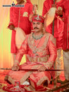 Traditional designer sherwani angarkha online in vibrant pink with intricate embroidery and regal accessories