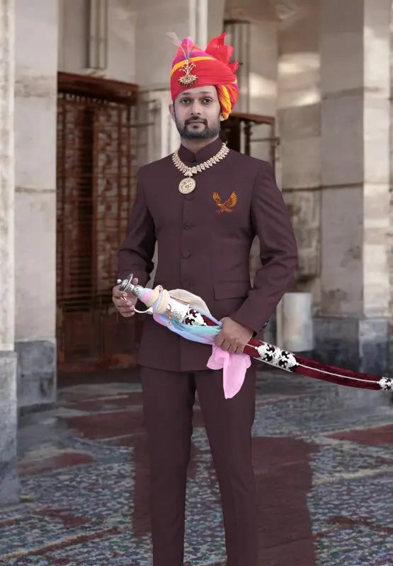 Stylish Eagle Logo Jodhpuri Suit in Brown with Traditional Accessories and Turban