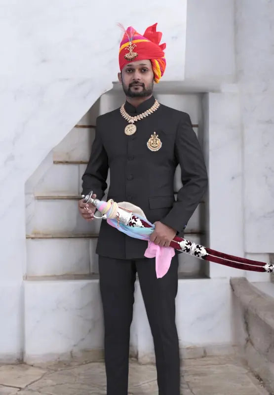 Stylish gents suit for wedding with intricate details and a vibrant turban, perfect for special occasions