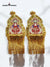 Gold epaulette accessories with intricate design and fringed edges for traditional attire.