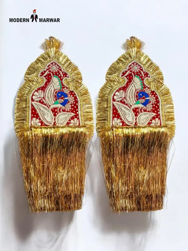 Golden ornamental accessory featuring intricate embroidery and decorative fringe for traditional attire