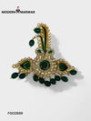 Green stone brooch with intricate design and pearl detailing from Modern Marwar