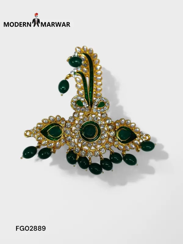 Green stone brooch with intricate design and pearl detailing from Modern Marwar