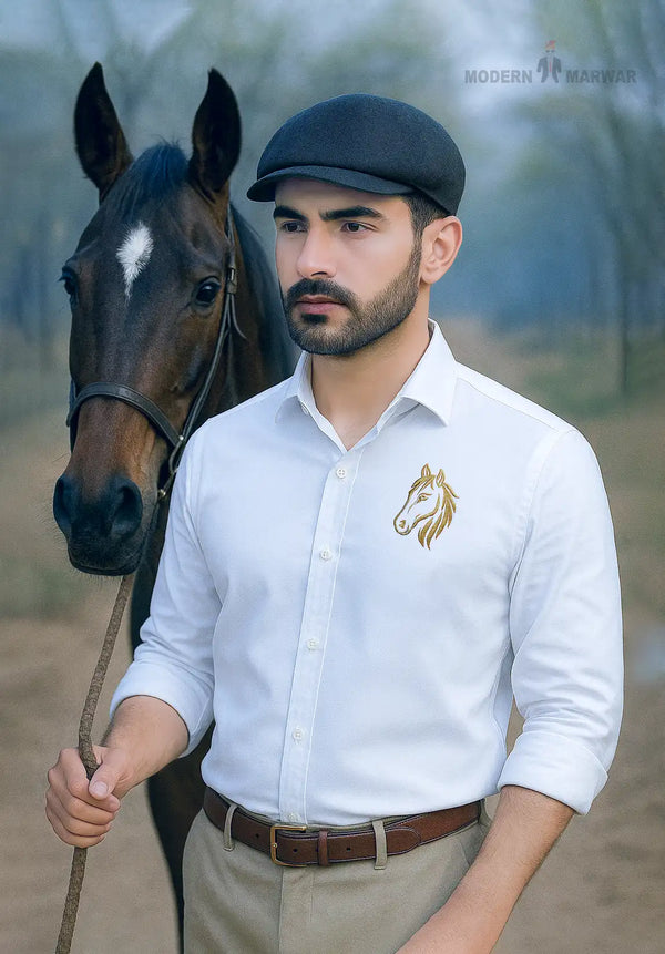 White horse logo men's shirts by MODERN MARWAR worn by a man standing next to a brown horse