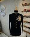 Elegant black Jodhpuri suit featuring an elephant logo Jodhpuri suit design with ornate details