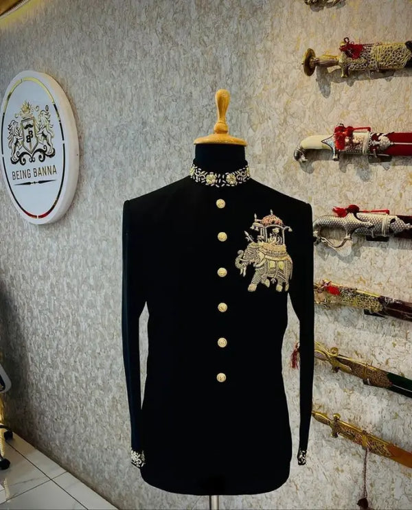 Elegant black Jodhpuri suit featuring an elephant logo Jodhpuri suit design with ornate details