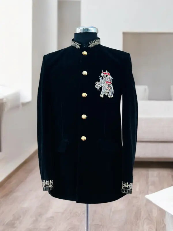 Elegant black Jodhpuri suit featuring an intricate elephant logo for stylish formal occasions