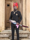 Elegant Jodhpuri suit for men styled with traditional accessories and a royal turban