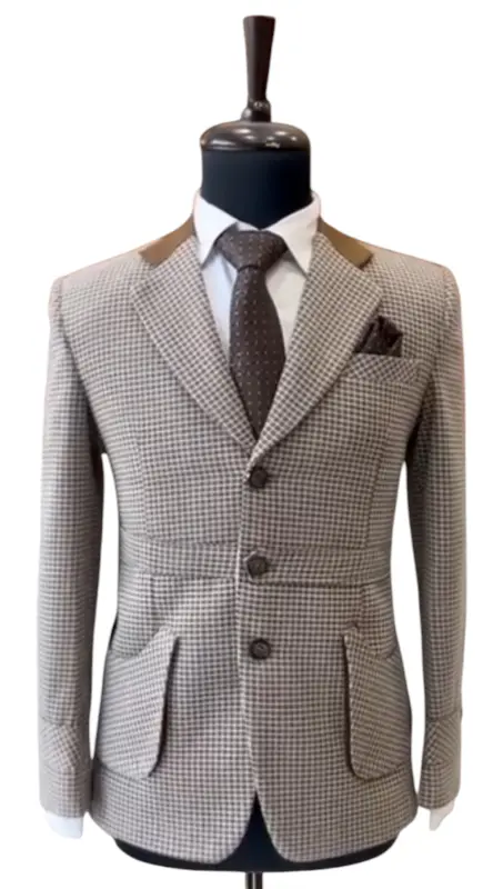 Stylish Jodhpuri suit for men with a checkered pattern and elegant pocket square detail