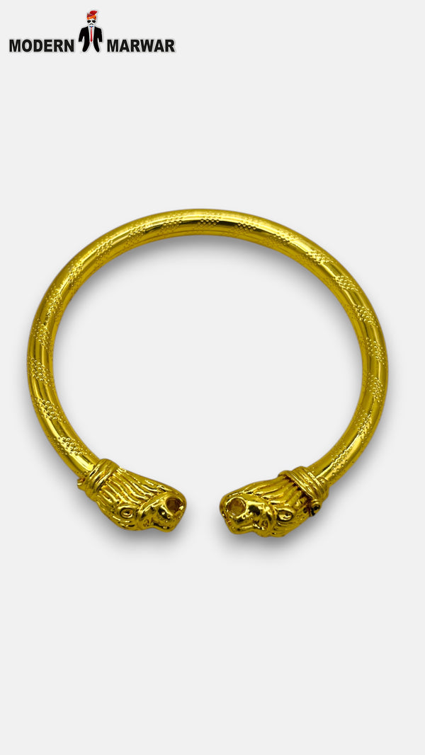 M HAND USE Gold Kada-1 with Intricate Lion Head Design from SINGH at a Side Angle