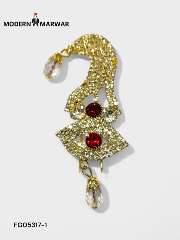 Luxury men's brooch with gold design and red crystals, featuring teardrop accents for a stylish look