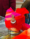 Vibrant red luxury men's turban featuring intricate embellishments and a stylish design for special occasions