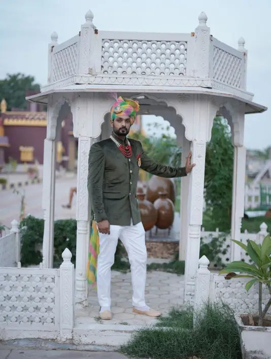 Modern Marwar luxury men's velvet coat showcased in a traditional setting with stylish accessories