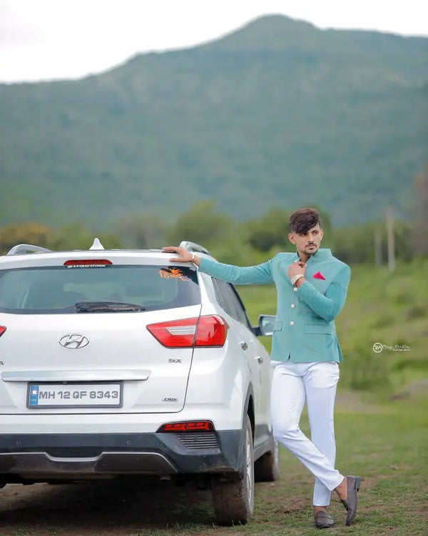 Modern Marwar luxury men's velvet coat styled in a fashionable outdoor setting with a car