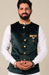 Stylish men's kurta pajama set in dark green with elegant buttons and pocket detailing