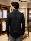 Men's black cotton shirt from SINGH, showcasing a back view in a stylish display setting, mens plain shirt