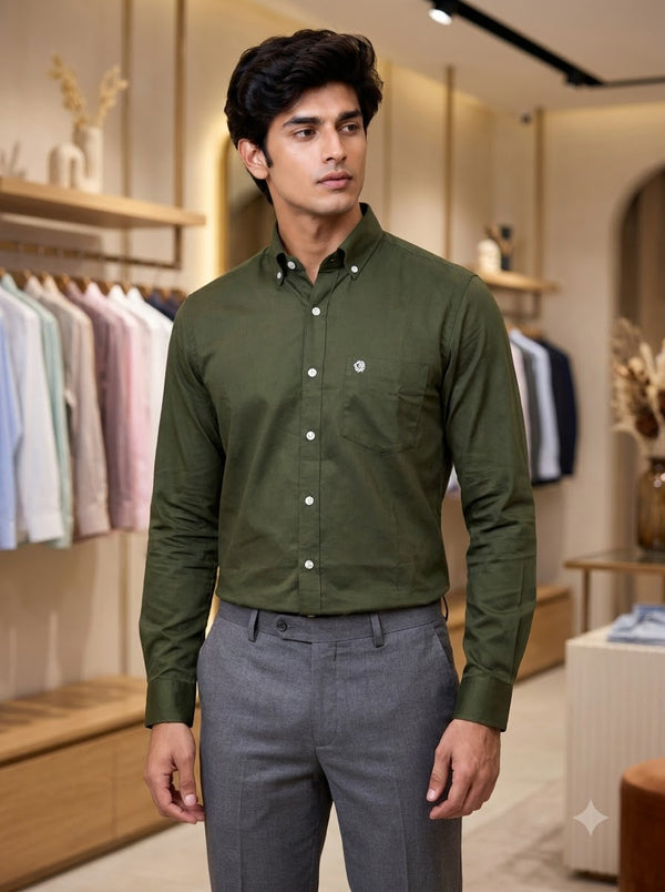 Men's green cotton plain shirt from SINGH displayed in a retail setting