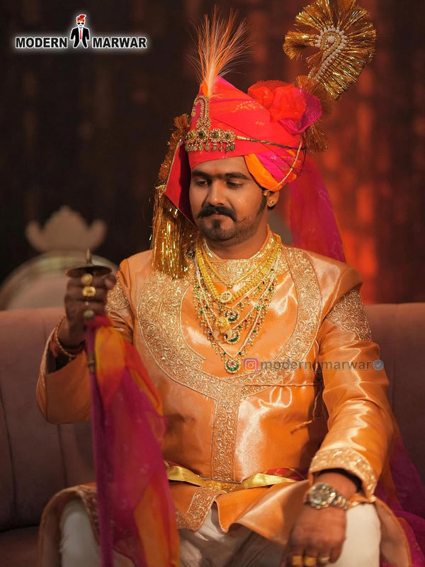 Elegant men's sherwani angarkha in peach with intricate embroidery and royal accessories