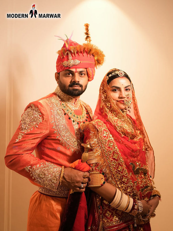 Stylish men's sherwani angarkha in vibrant orange with elegant embroidery, perfect for formal occasions