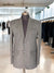 Stylish men's tweed blazer by Modern Marwar displayed on a mannequin in a boutique