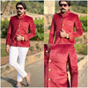 Stylish men's wedding coat suit in red velvet with gold buttons, worn with white pants for a formal look