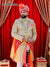 Elegant wedding groom sherwani in cream with intricate embroidery and vibrant colors for special occasions