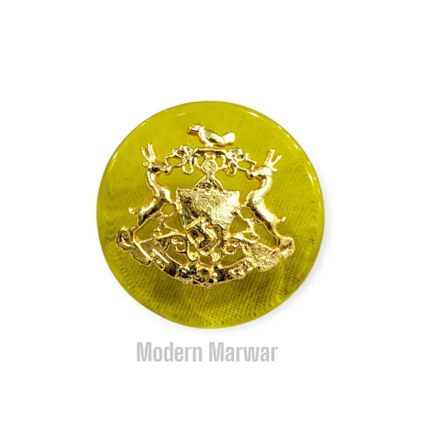 Modern Marwar Bhati logo button in vibrant yellow with intricate gold detailing