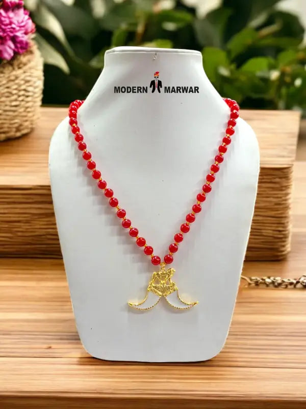 Colorful bead necklace with red beads and a gold pendant design from Modern Marwar