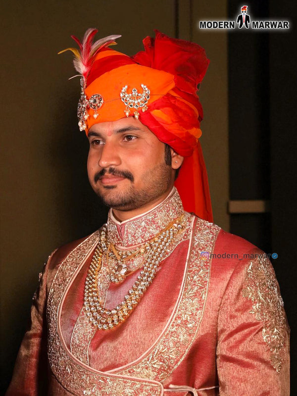 Elegant designer angarkha sherwani for men with intricate embroidery and vibrant turban