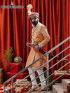 Elegant sherwani angarkha for men in gold with intricate embroidery and decorative sword accessory