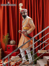 Elegant sherwani angarkha for men in gold with intricate embroidery and decorative sword accessory