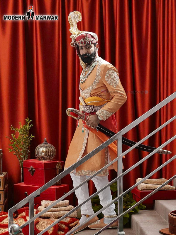 Elegant sherwani angarkha for men in gold with intricate embroidery and decorative sword accessory