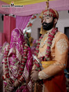 Elegant sherwani angarkha for men in vibrant orange, perfect for festive celebrations and weddings
