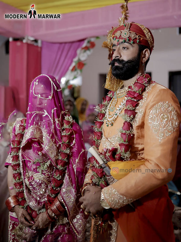 Elegant sherwani angarkha for men in vibrant orange, perfect for festive celebrations and weddings