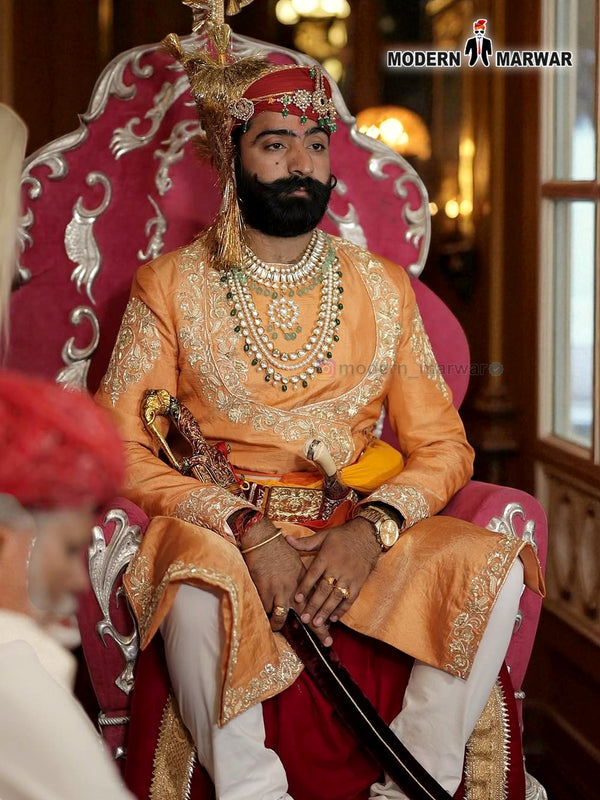 Elegant sherwani angarkha for men in orange with intricate embroidery and regal accessories