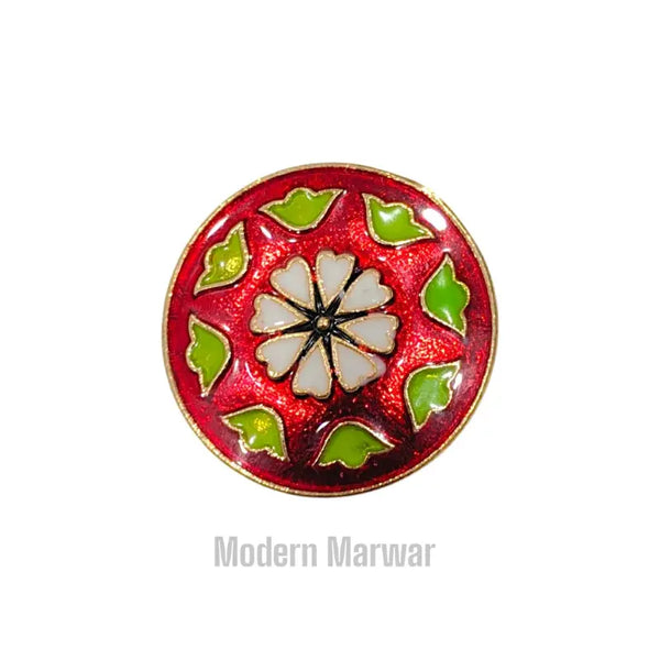 Colorful decorative button with traditional button design featuring floral patterns and vibrant colors
