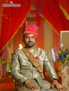 Elegant wedding groom sherwani in silver with intricate embroidery and matching accessories