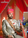 Elegant wedding groom sherwani in silver with intricate patterns, perfect for a royal celebration