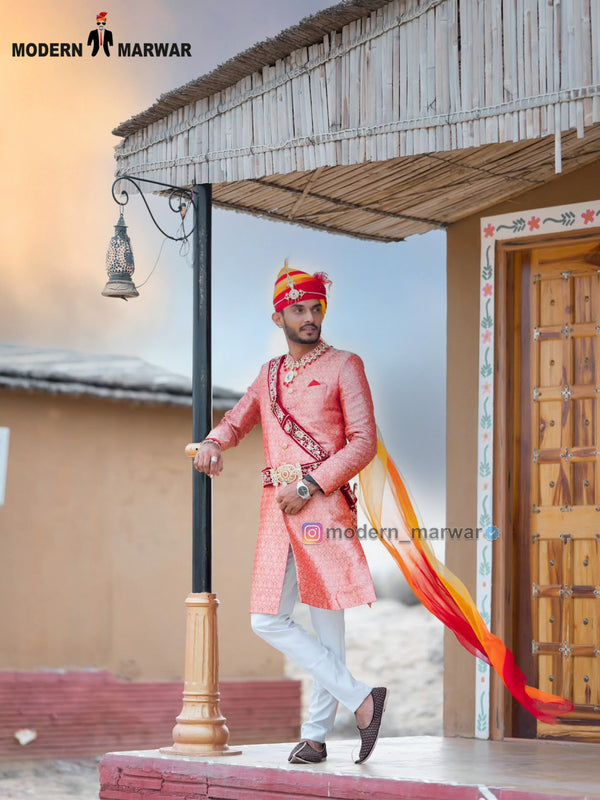 Elegant wedding groom sherwani in peach with intricate embroidery and stylish accessories
