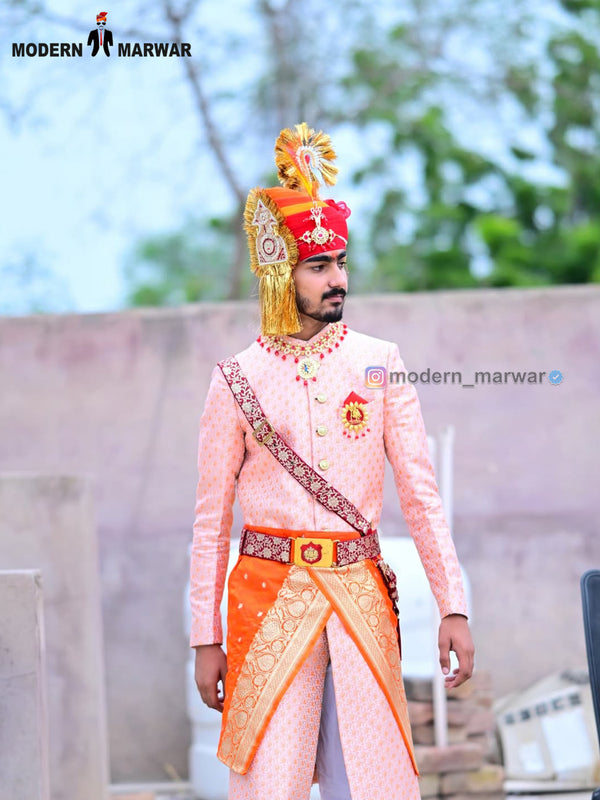 Elegant wedding groom sherwani in pink with intricate designs and embellished details